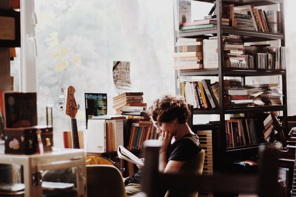 girl reading in a room